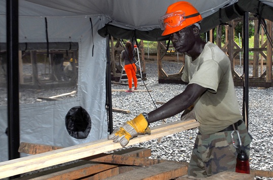 Troop support provides building materials for Ebola mission