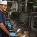 1st Class Petty Officer Association Sailors serve food aboard USS Carl Vinson