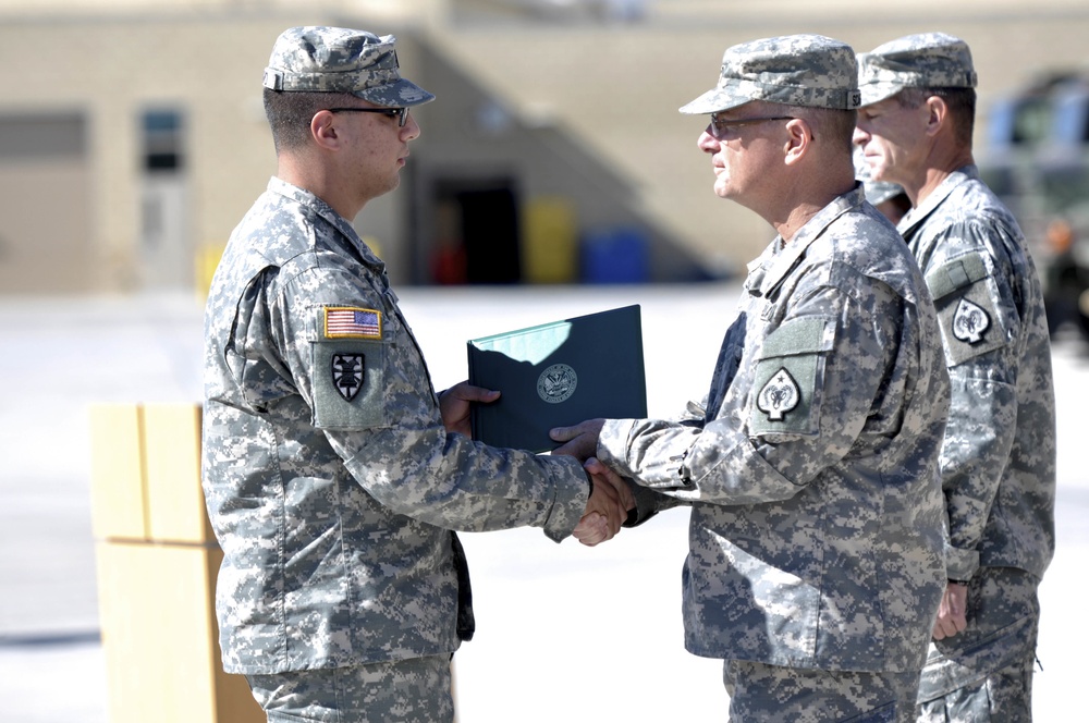 Nevada National Guard Soldiers receive awards for pulling car-crash victim from burning vehicle, assisting at the scene of the accident