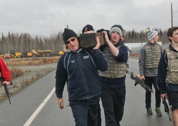 Eagle River High School hockey players work out with 1-Geronimo paratroopers