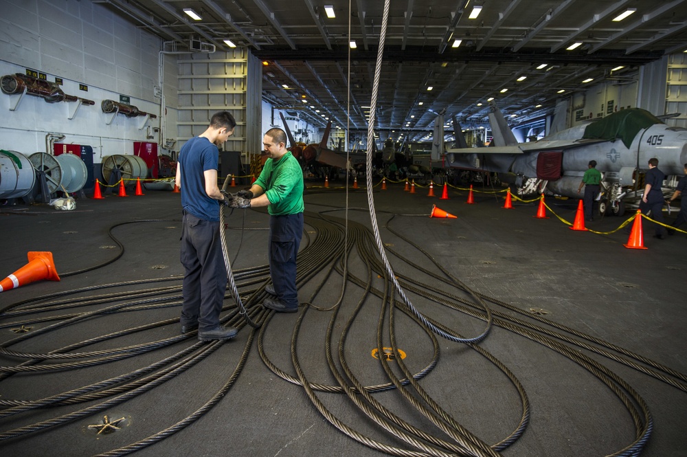 USS George Washington sailors conduct maintenance
