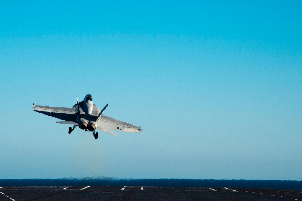 Hornet launches off Nimitz flight deck