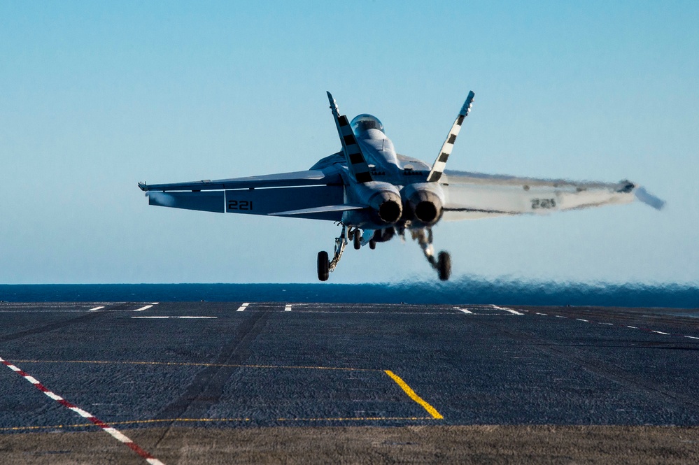 Hornet launches off Nimitz flight deck