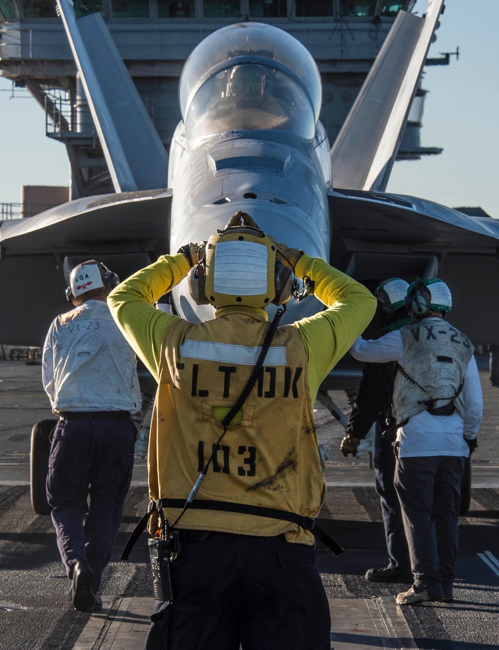 Nimitz Sailor directs Hornet onto catapult