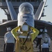 Nimitz Sailor directs Hornet onto catapult