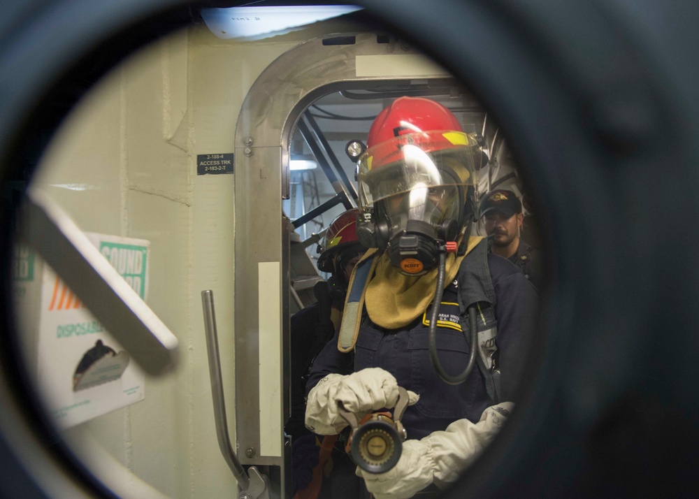 USS Dewey Sailors drill