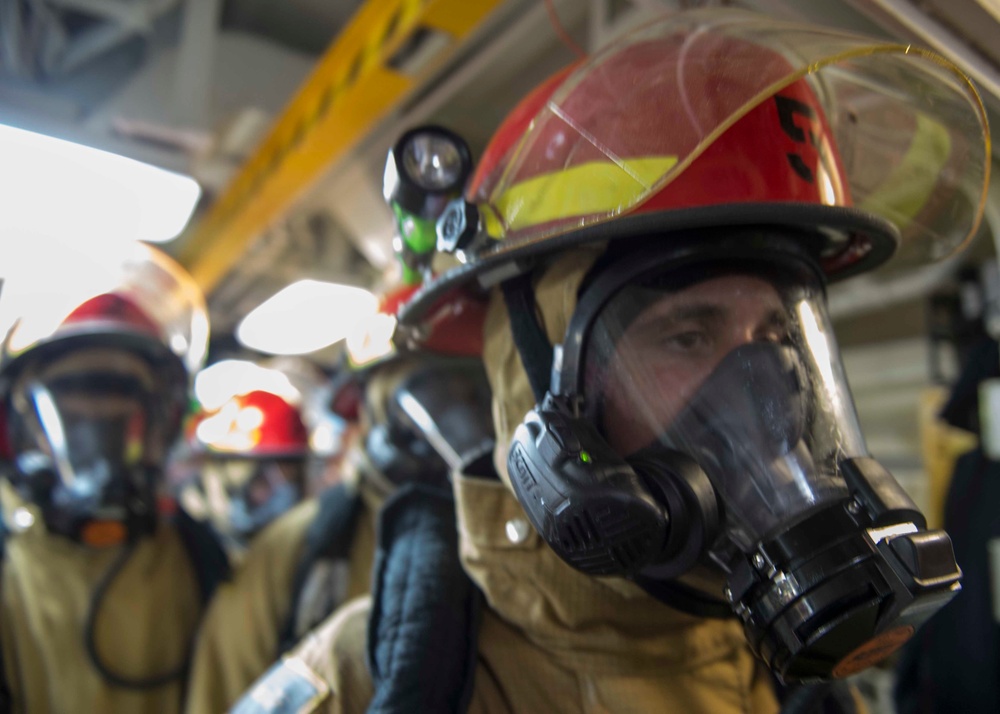 USS Dewey Sailors drill