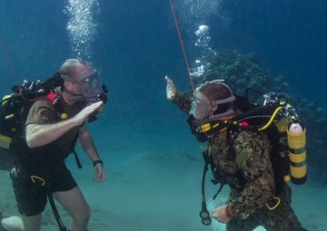 Explosive ordnance disposal divers