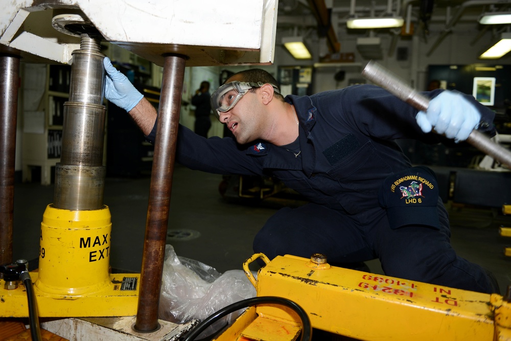 Sailor performs test in aviation ground support equipment shop