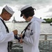 Sailors conduct colors at USS Arizona Memorial