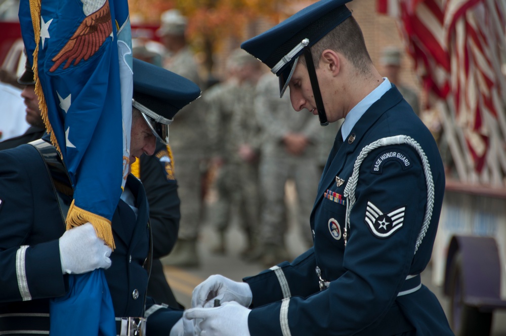 179th Airlift Wing and 200th RED HORSE members march in Veterans Day Parade