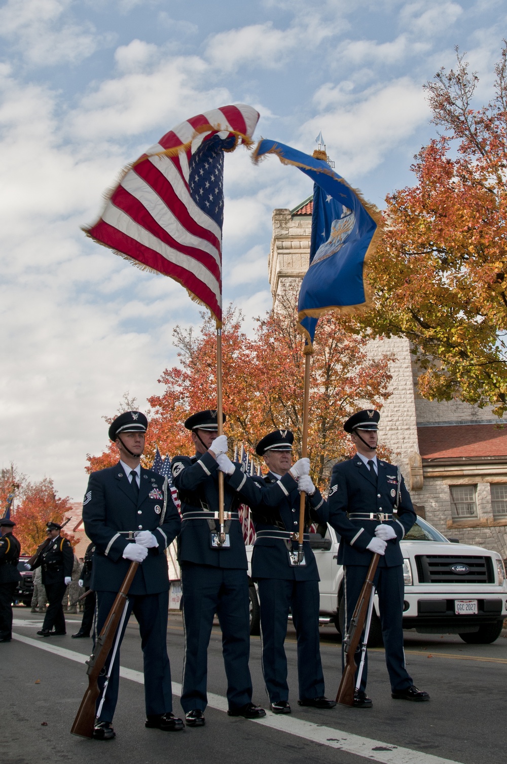 179th Airlift Wing and 200th RED HORSE members march in Veterans Day Parade