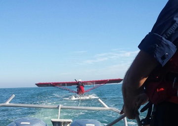 Coast Guard tows sea plane to port after emergency landing