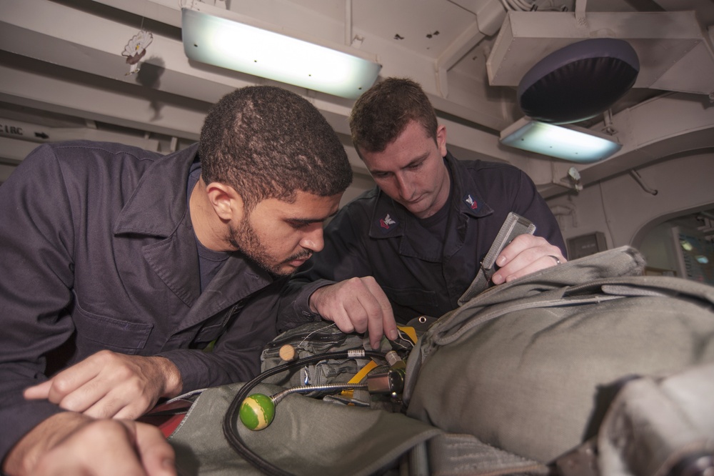 USS Carl Vinson Sailors conduct parachute maintenance