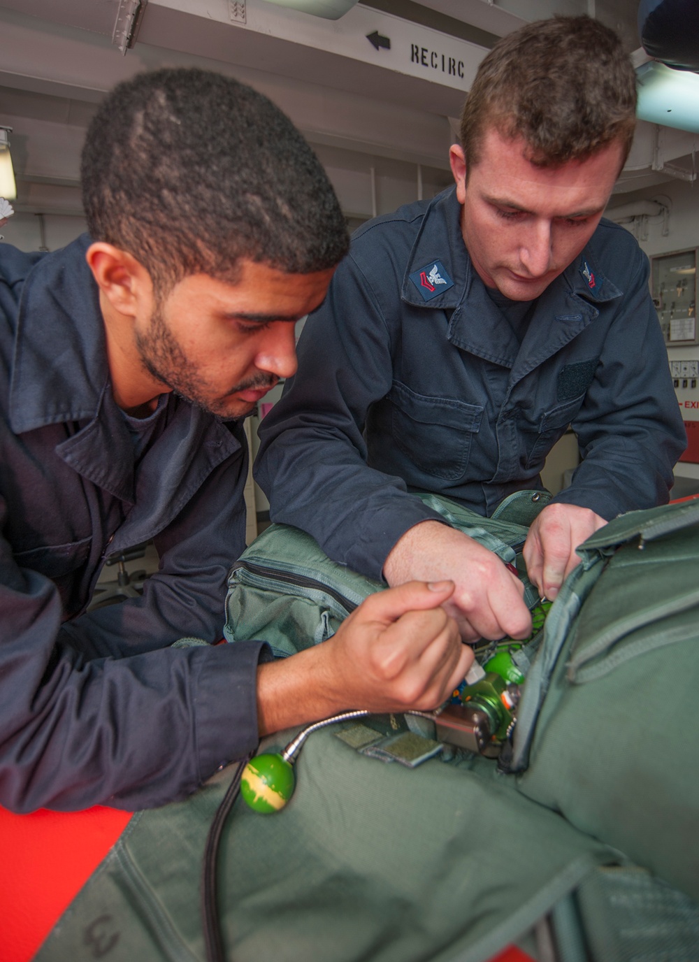 USS Carl Vinson Sailors conduct parachute maintenance