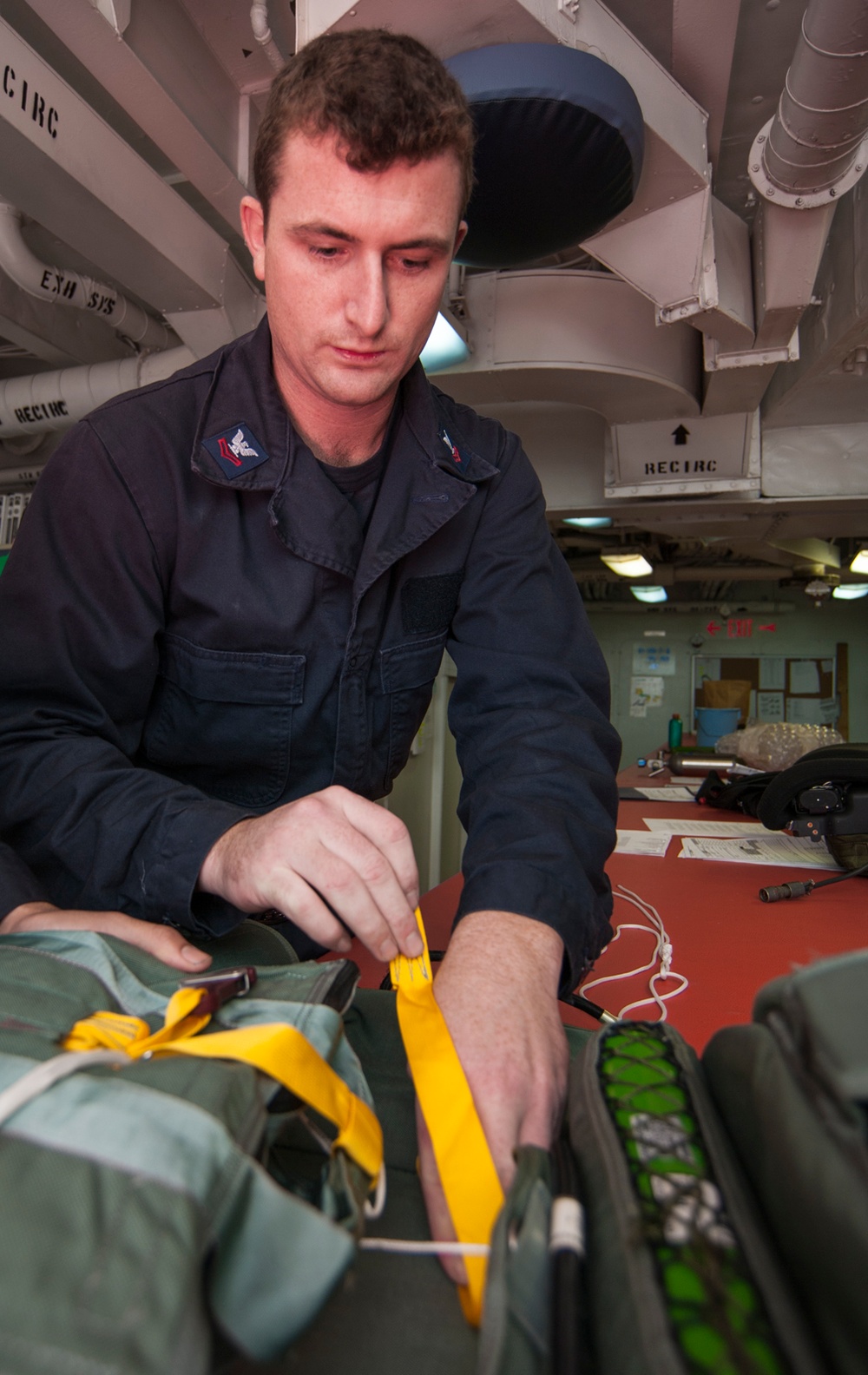 USS Carl Vinson Sailors conduct parachute maintenance