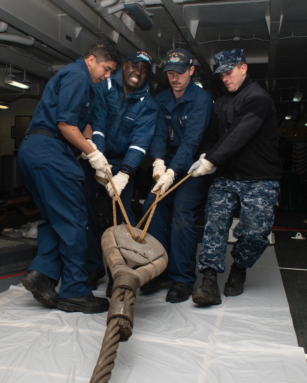 USS John C. Stennis perform maintenance on towing hawser
