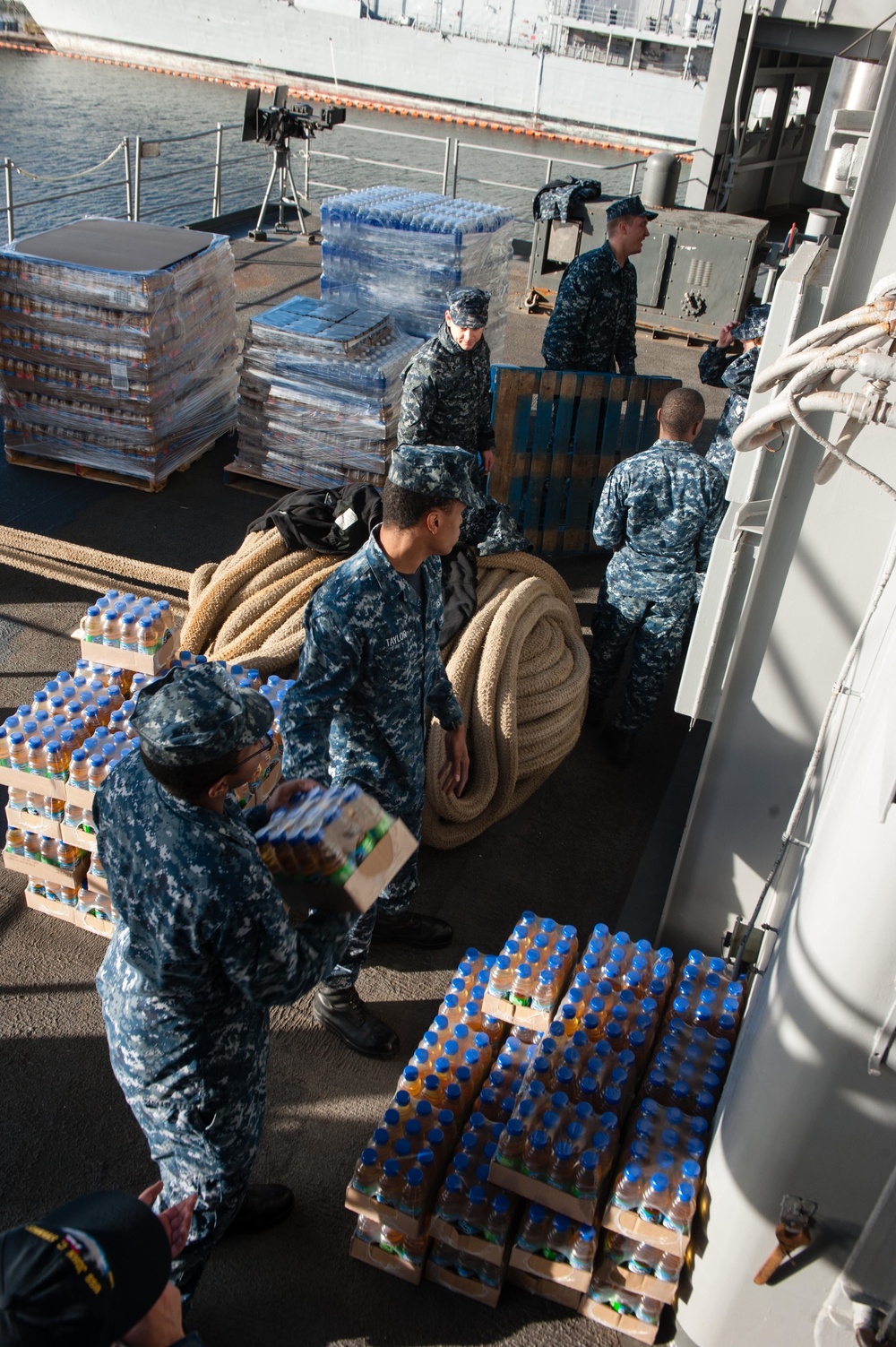 Sailors load supplies aboard USS John C. Stennis