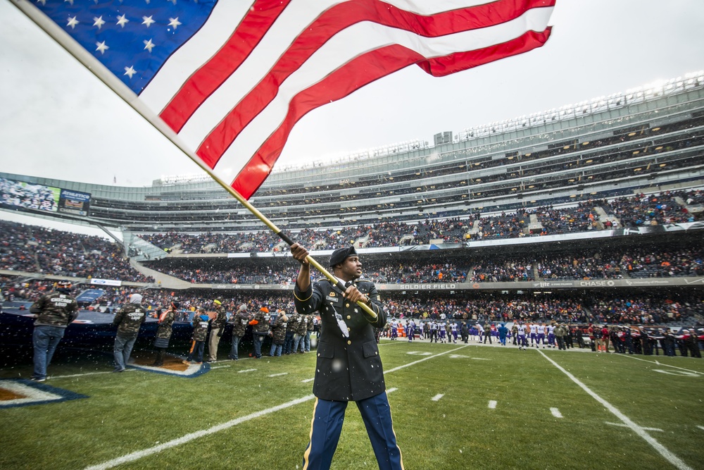 Salute to Service signage is seen on exterior of Soldier Field before an  NFL football game between the Chicago Bears and Minnesota Vikings, Monday,  Nov. 16, 2020, in Chicago. (AP Photo/Kamil Krzaczynski