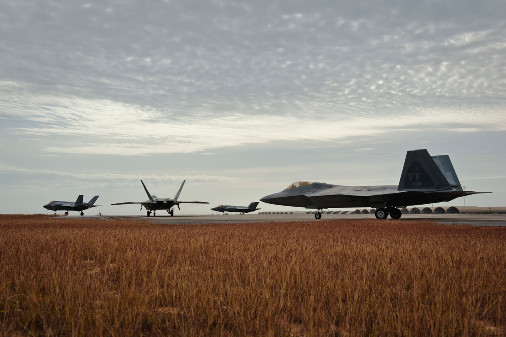 F-35 and F-22 combine capabilities in operational integration training mission