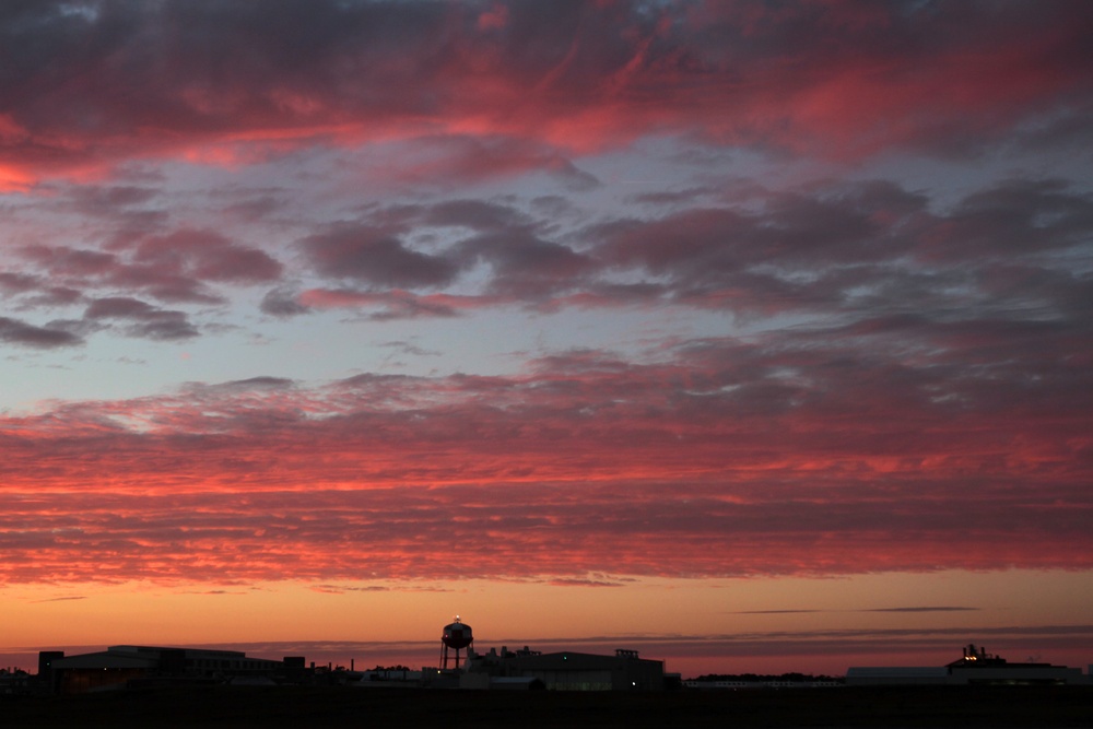 Sunset graces sky over MCAS Cherry Point, Osprey takes flight