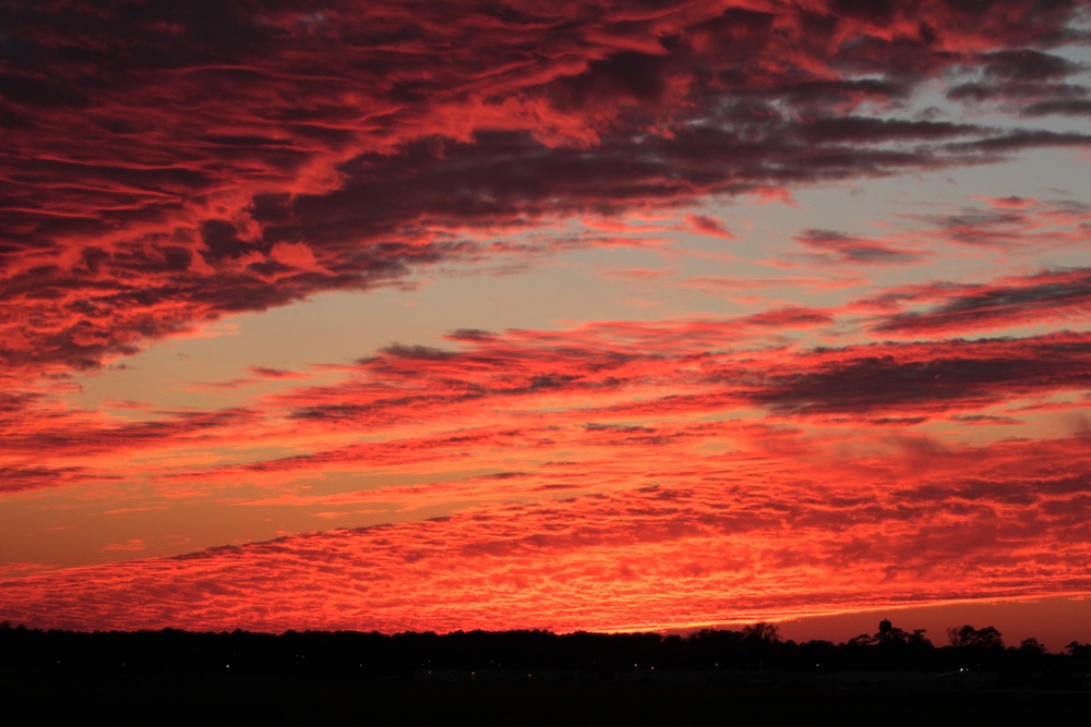 Sunset graces sky over MCAS Cherry Point, Osprey takes flight