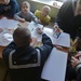 USS Vandegrift sailors color with Russian children in cancer ward