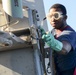 USS Sterett Sailor performs maintenance