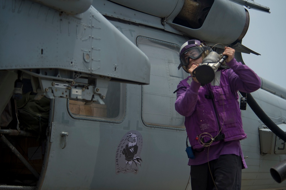 Refueling MH-60S Sea Hawk helicopter