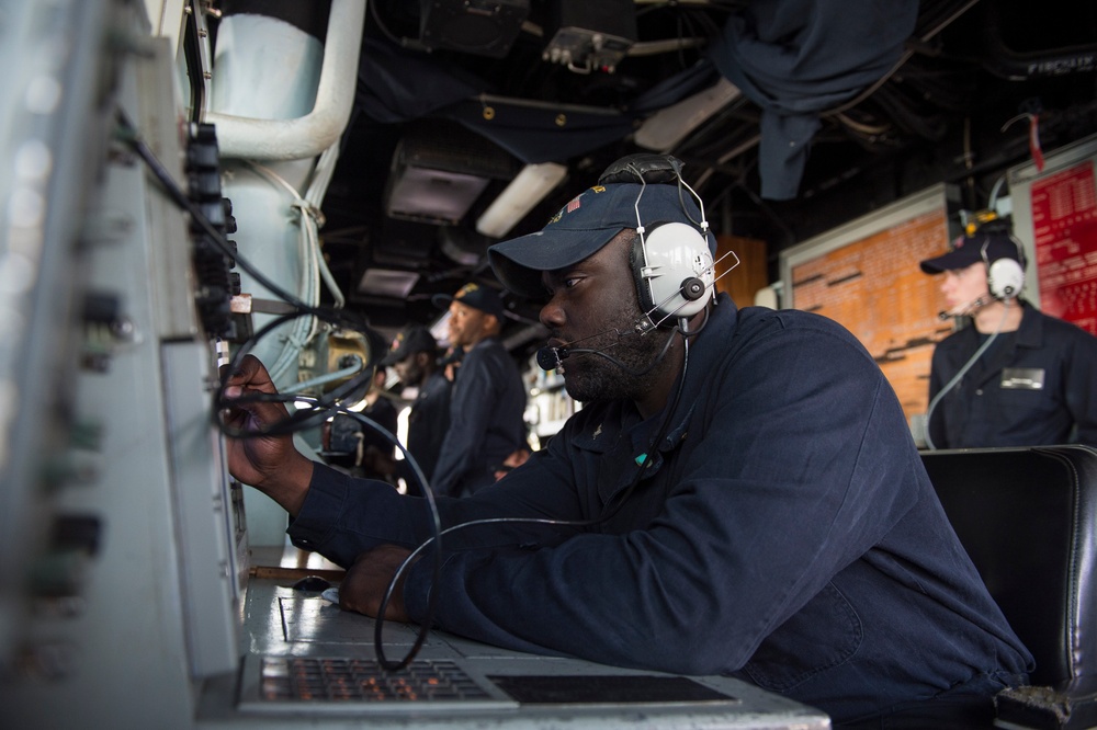 Operations specialist monitors inbound civilian-merchant traffic