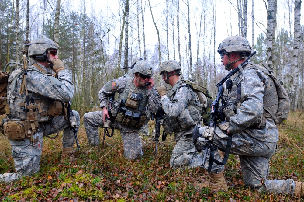Platoon leader establishes communications before movement to objective