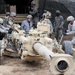 Paratroopers showcase modern howitzer for World War II artilleryman