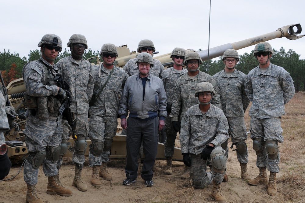 Paratroopers showcase modern howitzer for World War II artilleryman