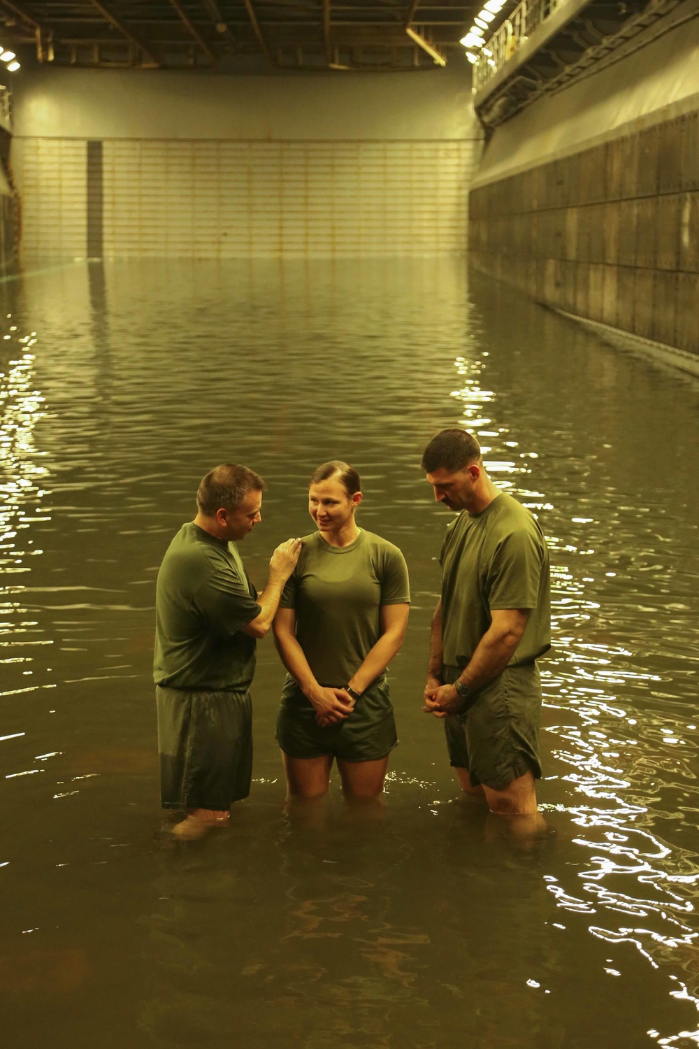 Marines and sailors get baptised aboard the USS Makin Island