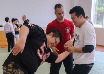 “Take ‘em to the deck!”: Marines teach Okinawan students MCMAP