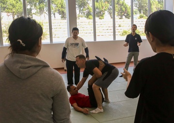 “Take ‘em to the deck!”: Marines teach Okinawan students MCMAP