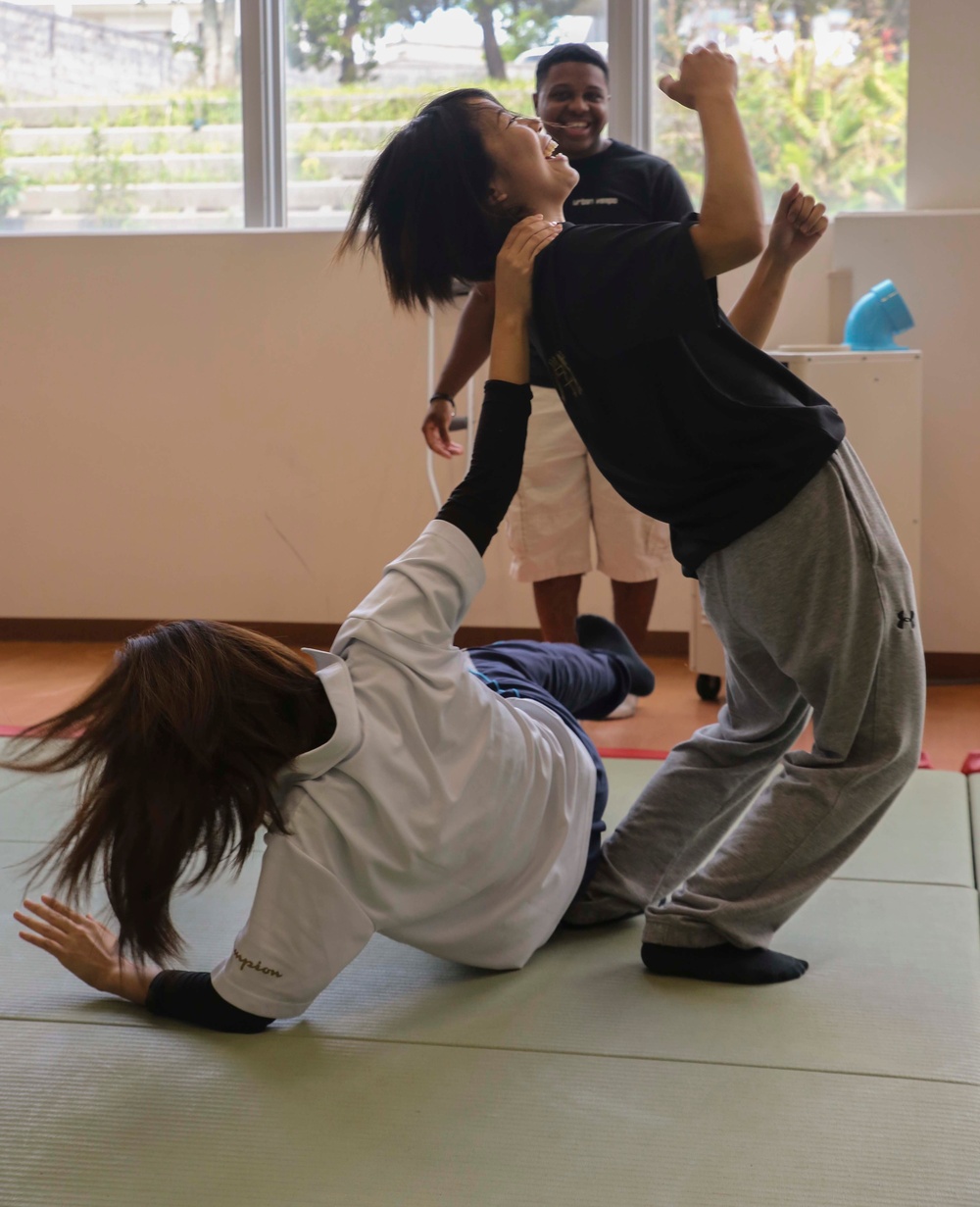 “Take ‘em to the deck!”: Marines teach Okinawan students MCMAP