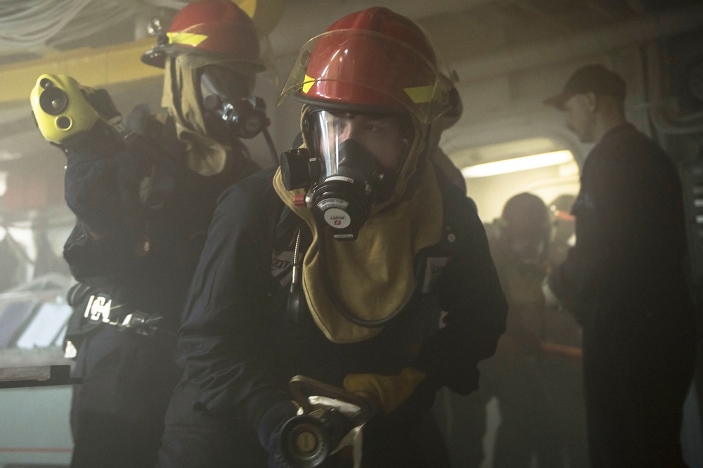 Sailors fight a simulated fire