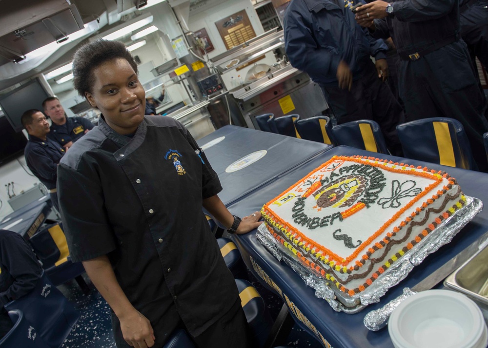USS Dewey Sailor prepares meals