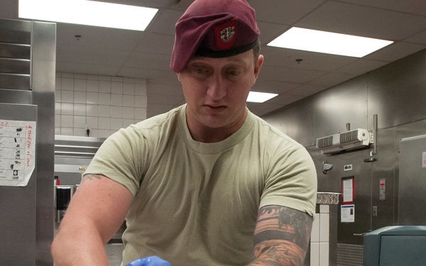 7th Special Forces Group (Airborne) Soldiers prepare Thanksgiving meal