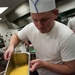 7th Special Forces Group (Airborne) Soldiers prepare Thanksgiving meal
