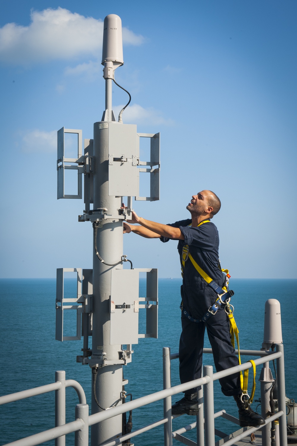 USS Carl Vinson Sailor inspects an antenna