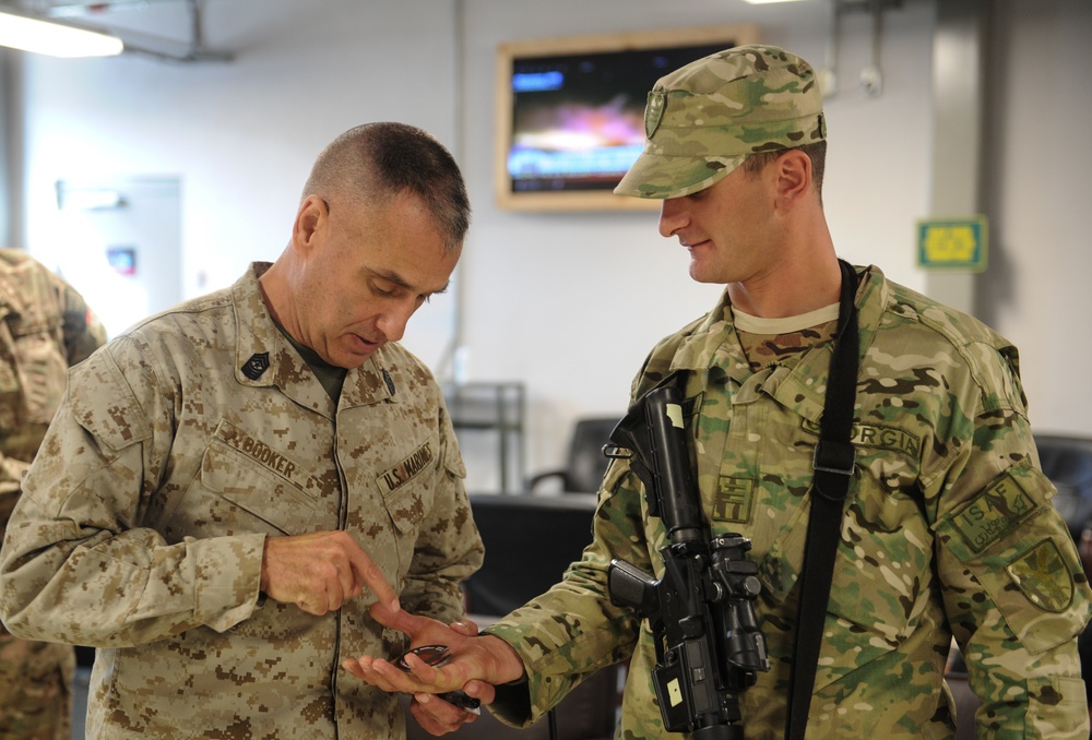 Senior Enlisted Leader of International Security Assistance Forces and US Forces - Afghanistan presents coin a Soldier with the Georgian Armed Forces