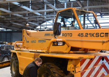 Belgian civilian workers fix and maintain Army properties.