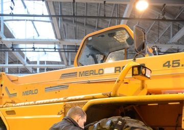 Belgian civilian workers fix and maintain Army properties.