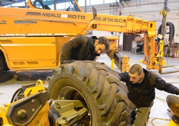 Belgian civilian workers fix and maintain Army properties.