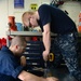 USS Nimitz sailors build a container