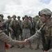 Deanie Dempsey shakes hands with an Airman