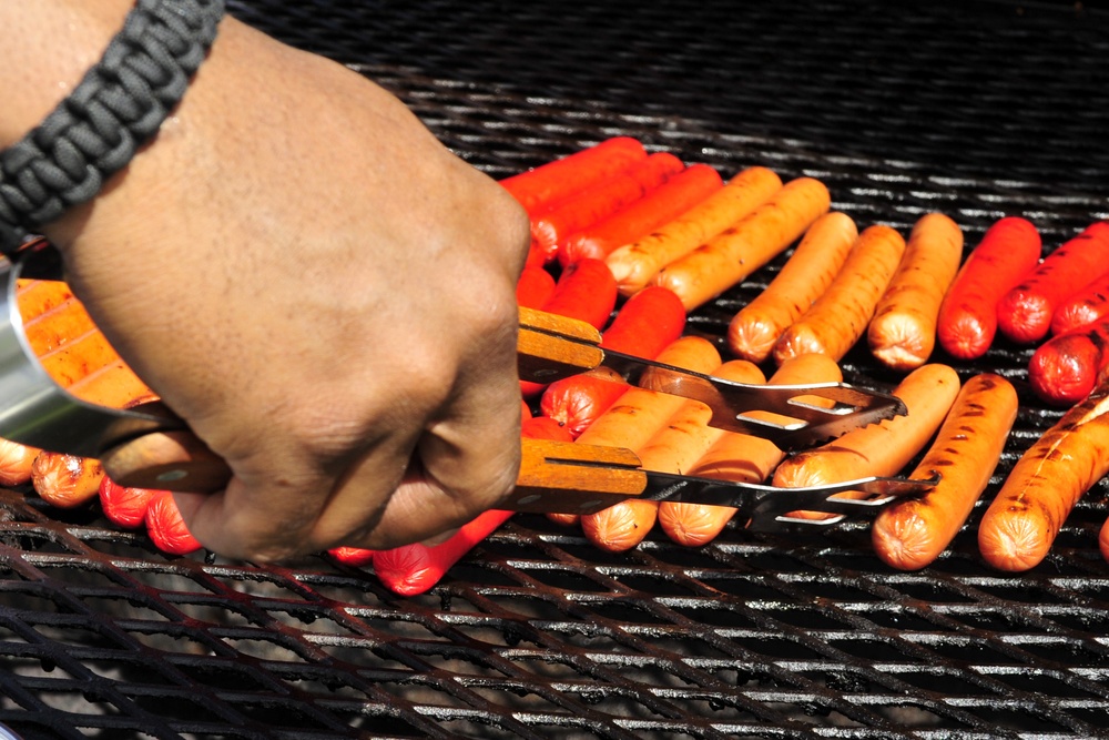 Airmen get their fill of warm weather, comfort food during BBQ