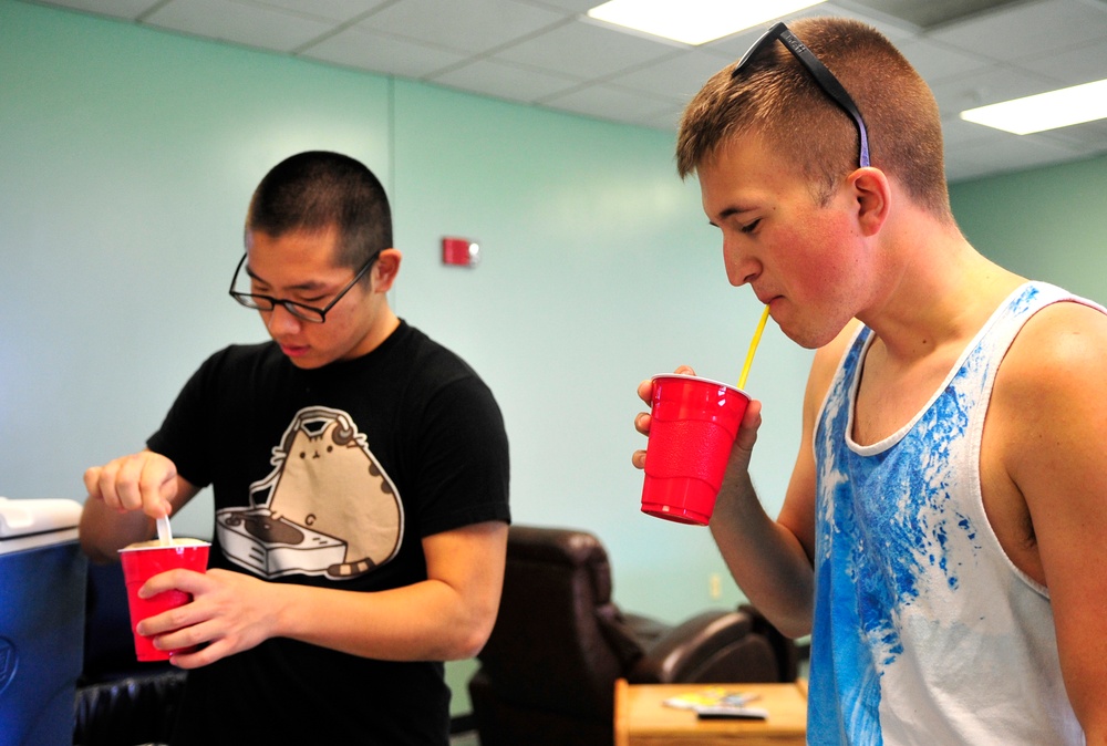 Airmen get their fill of warm weather, comfort food during BBQ